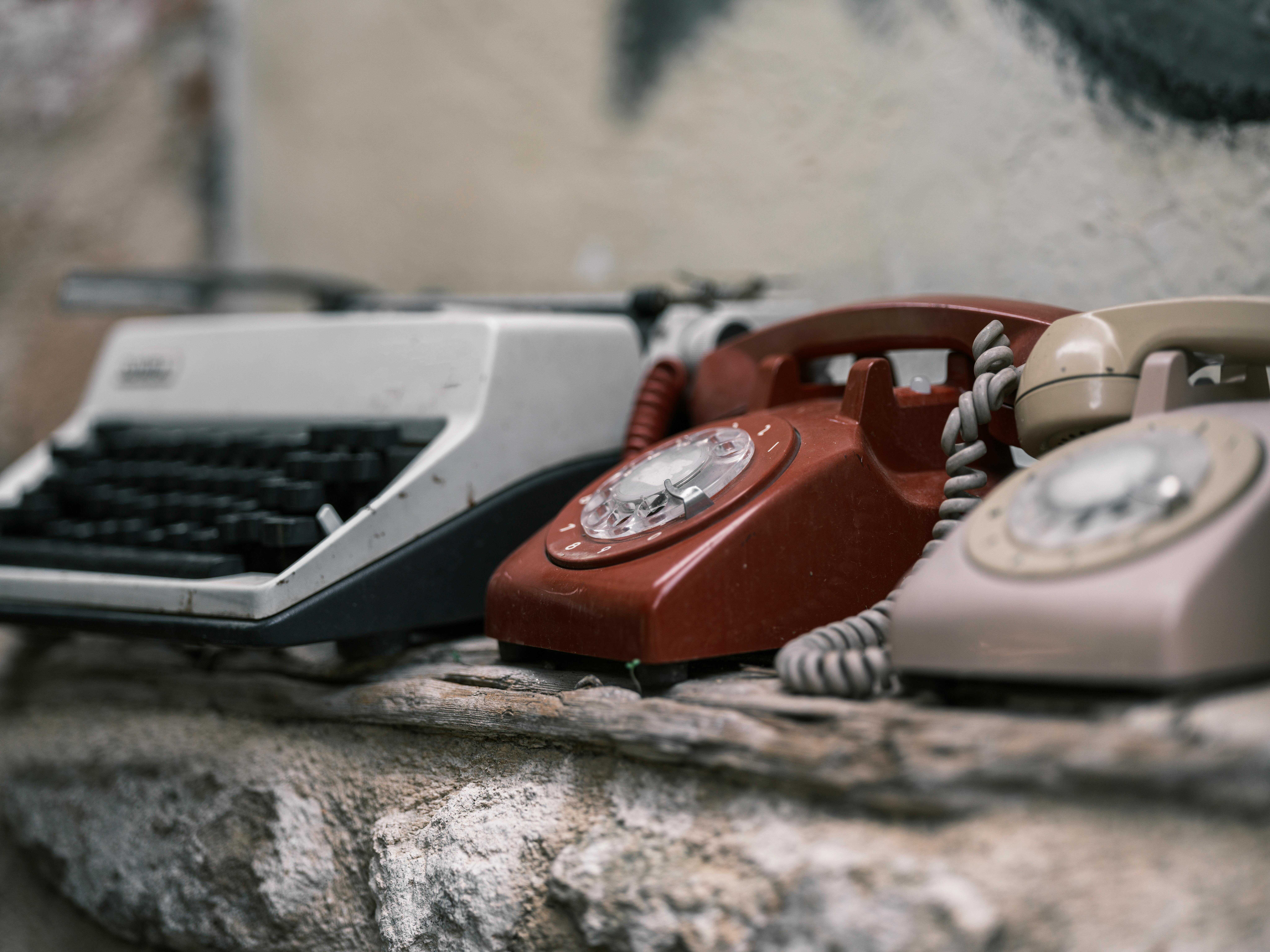 An old-fashioned desk with a telephone and letters